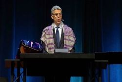 Rabbi Rick Jacobs on stage with the Torah during Shabbat morning services at the URJ Biennial